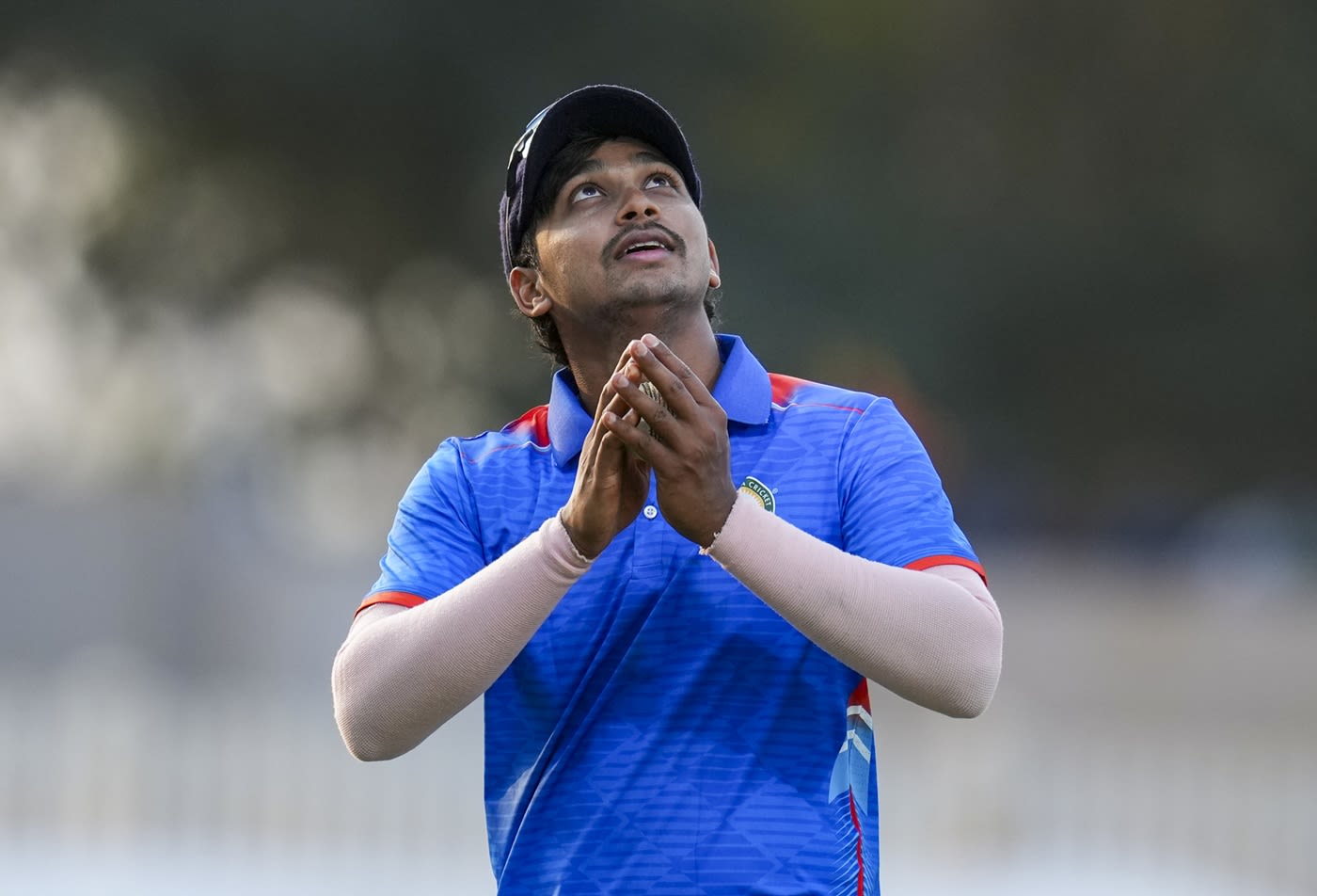 Darshan Nalkande looks skywards after his five-wicket haul