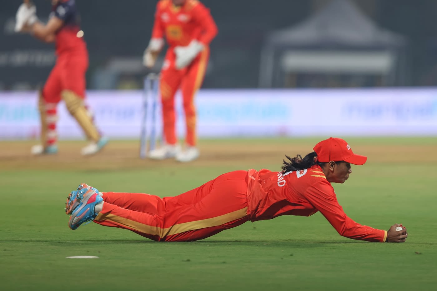 Rajeshwari Gayakwad takes a diving catch to dismiss Smriti Mandhana