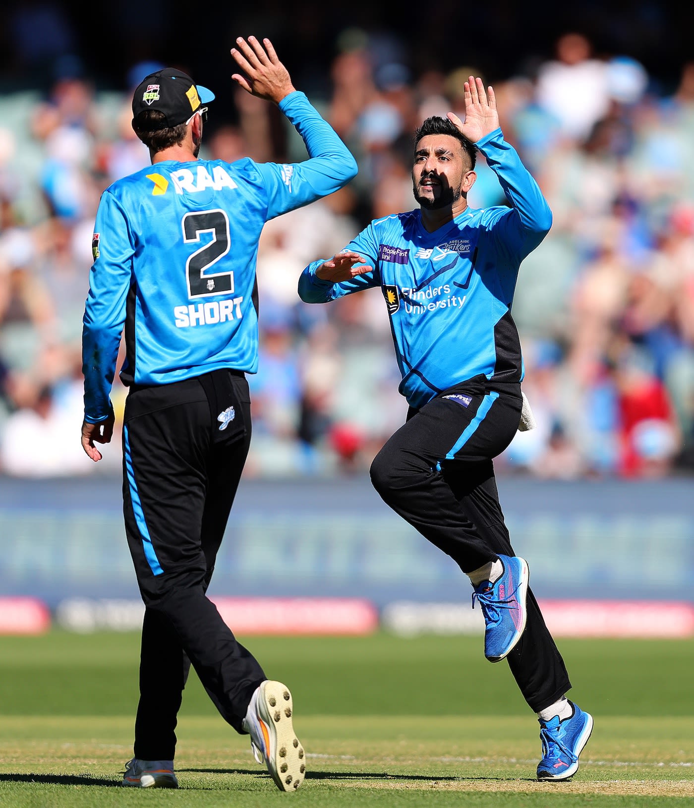 Tabraiz Shamsi celebrates a wicket with Matt Short