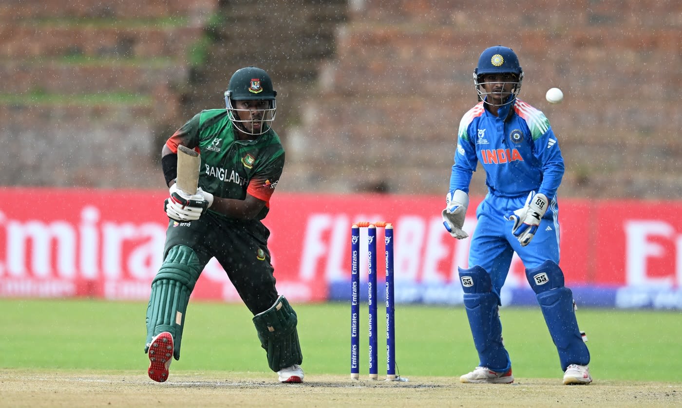 Azizul Hakim bats in the rain