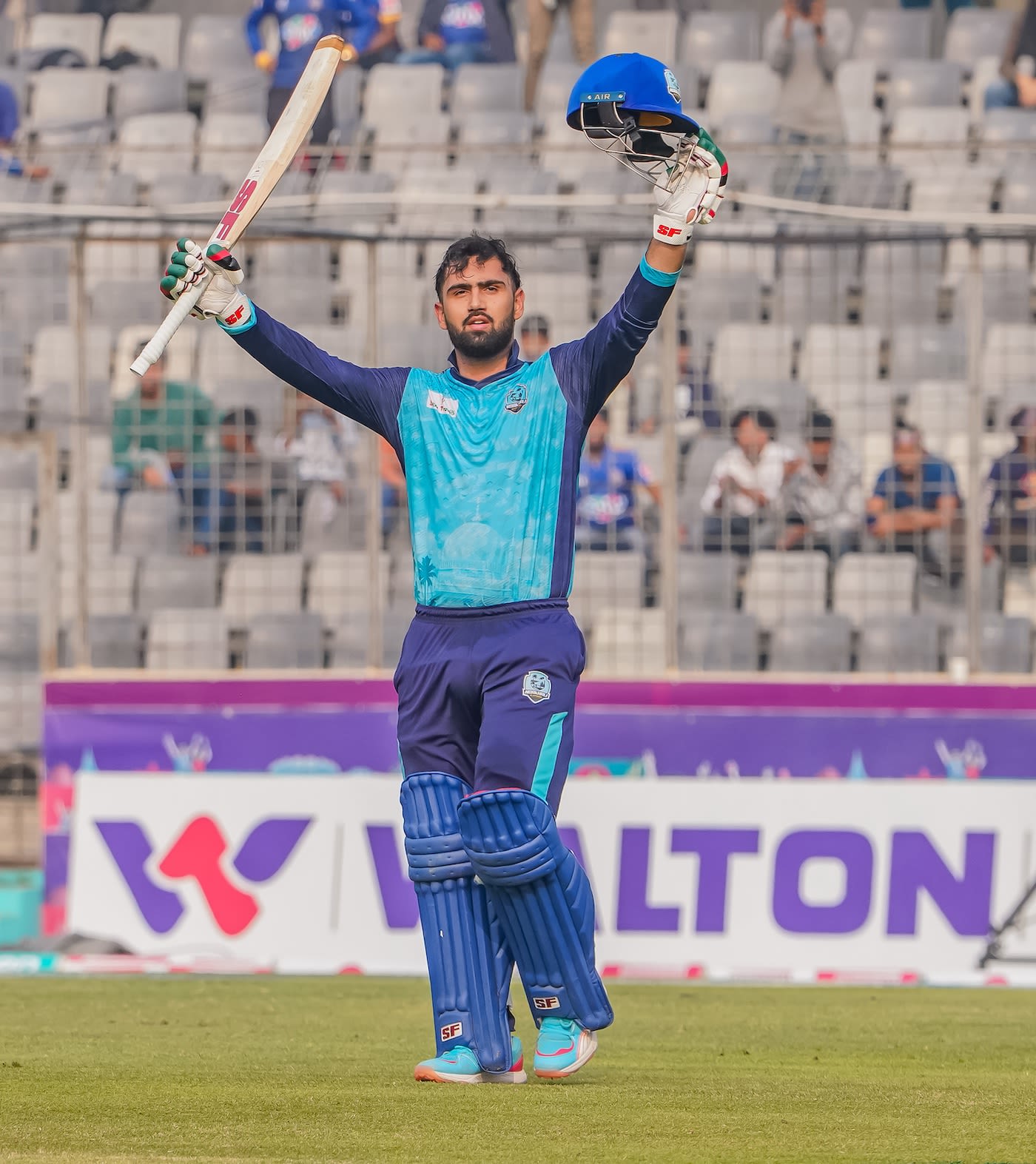 Hassan Eisakhil celebrates his hundred