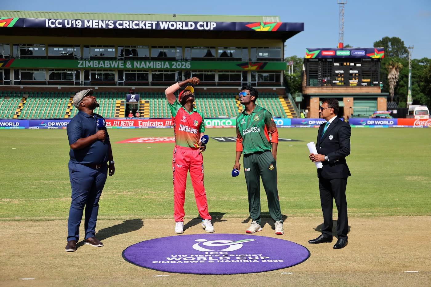 Azizul Hakim Tamim and Simbarashe Mudzengerere at the toss