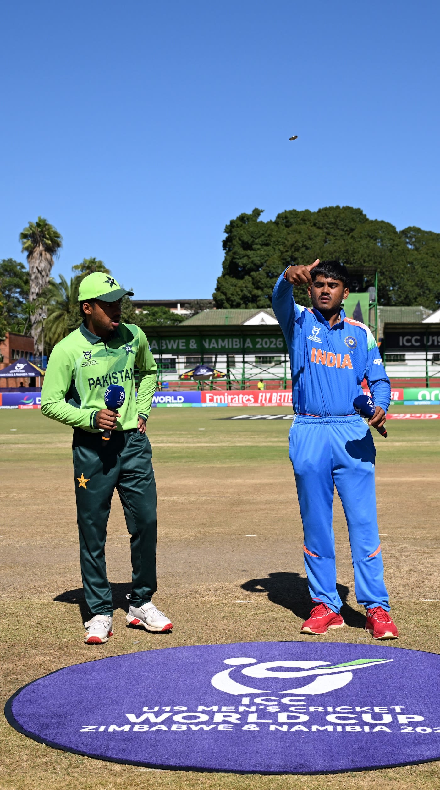 Ayush Mhatre flips the coin; Farhan Yousaf called right and opted to bowl