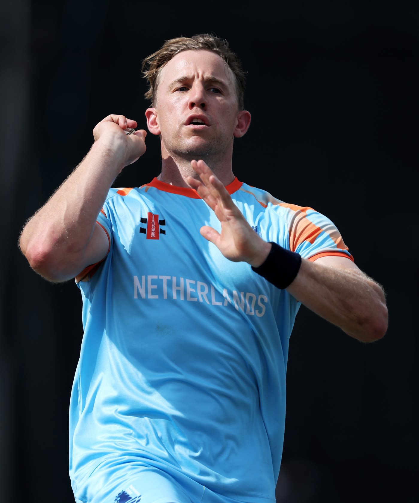 Logan van Beek gets ready to bowl at a training session