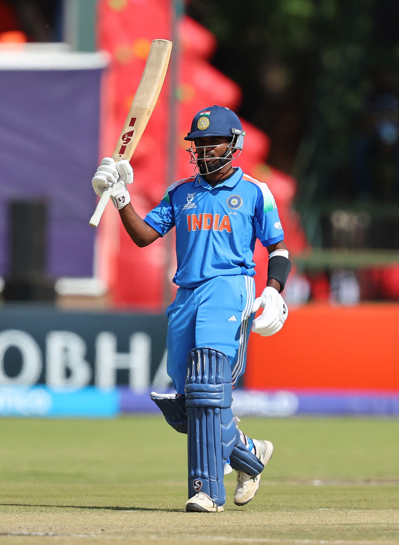 Aaron George celebrates his fifty