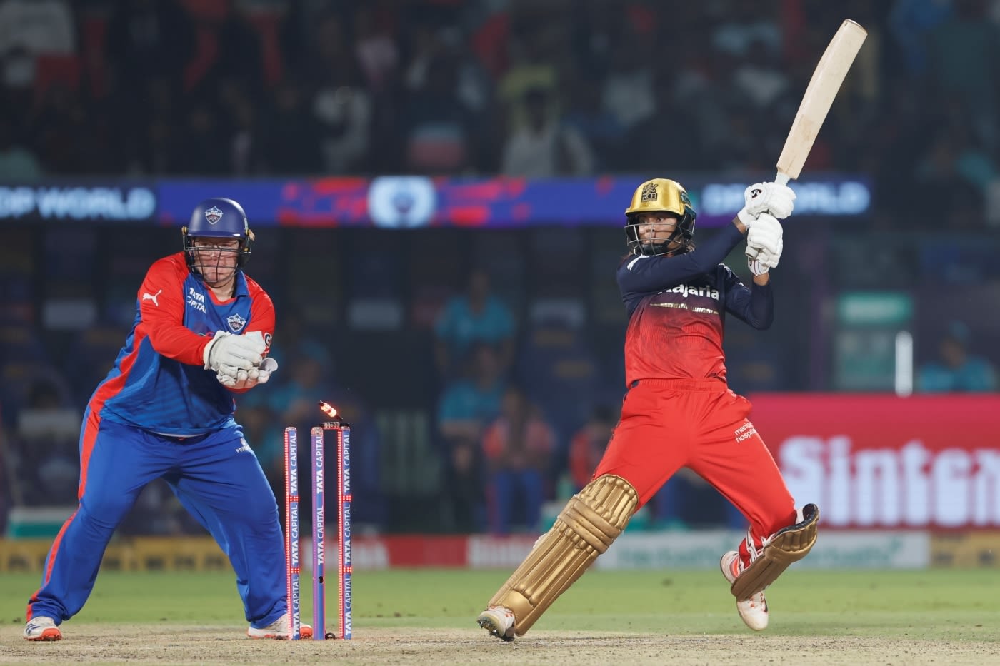 Radha Yadav hits the winning boundary, with an errant bail adding a dash of drama
