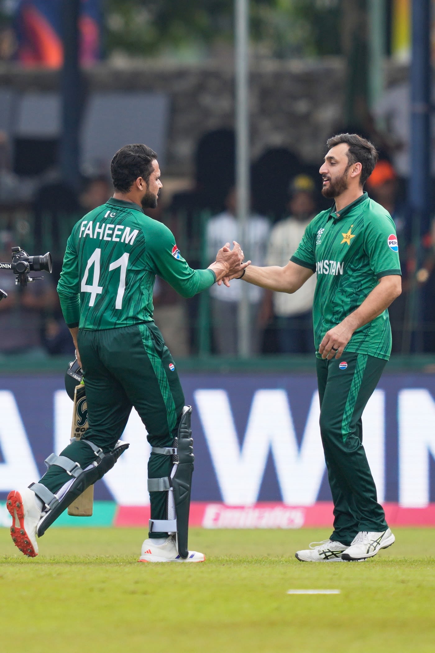Faheem Ashraf is greeted by Salman Agha after the win