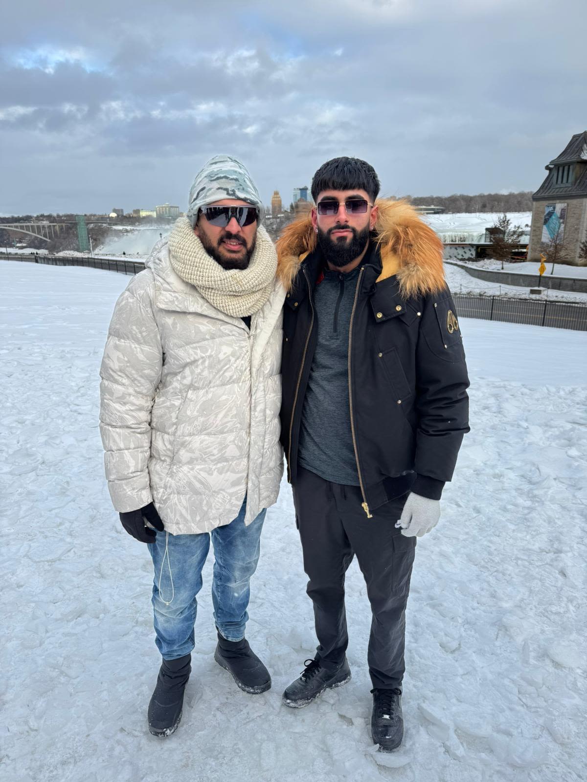 Yuvraj Samra and his father Baljit pose in the snow