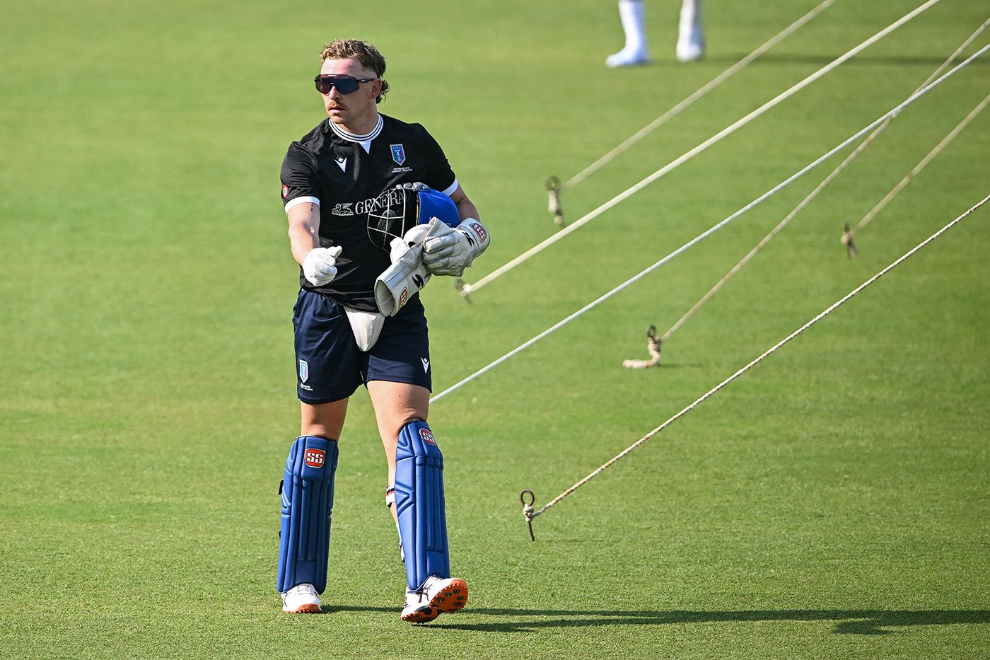 Gian-Piero Meade dons the wicketkeeping gloves at Italy training