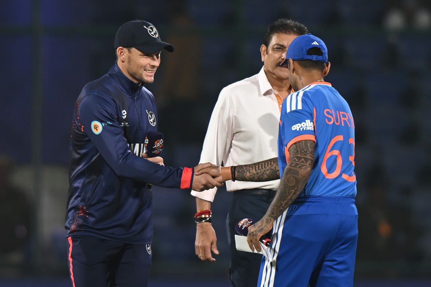 Gerhard Erasmus and Suryakumar Yadav with Ravi Shastri at the toss