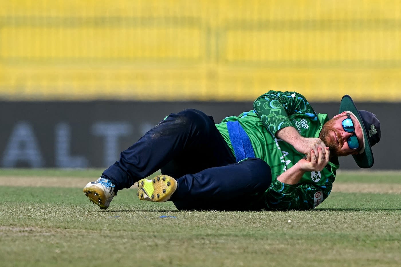 Paul Stirling takes a tumble after taking the catch to dismiss Josh Inglis