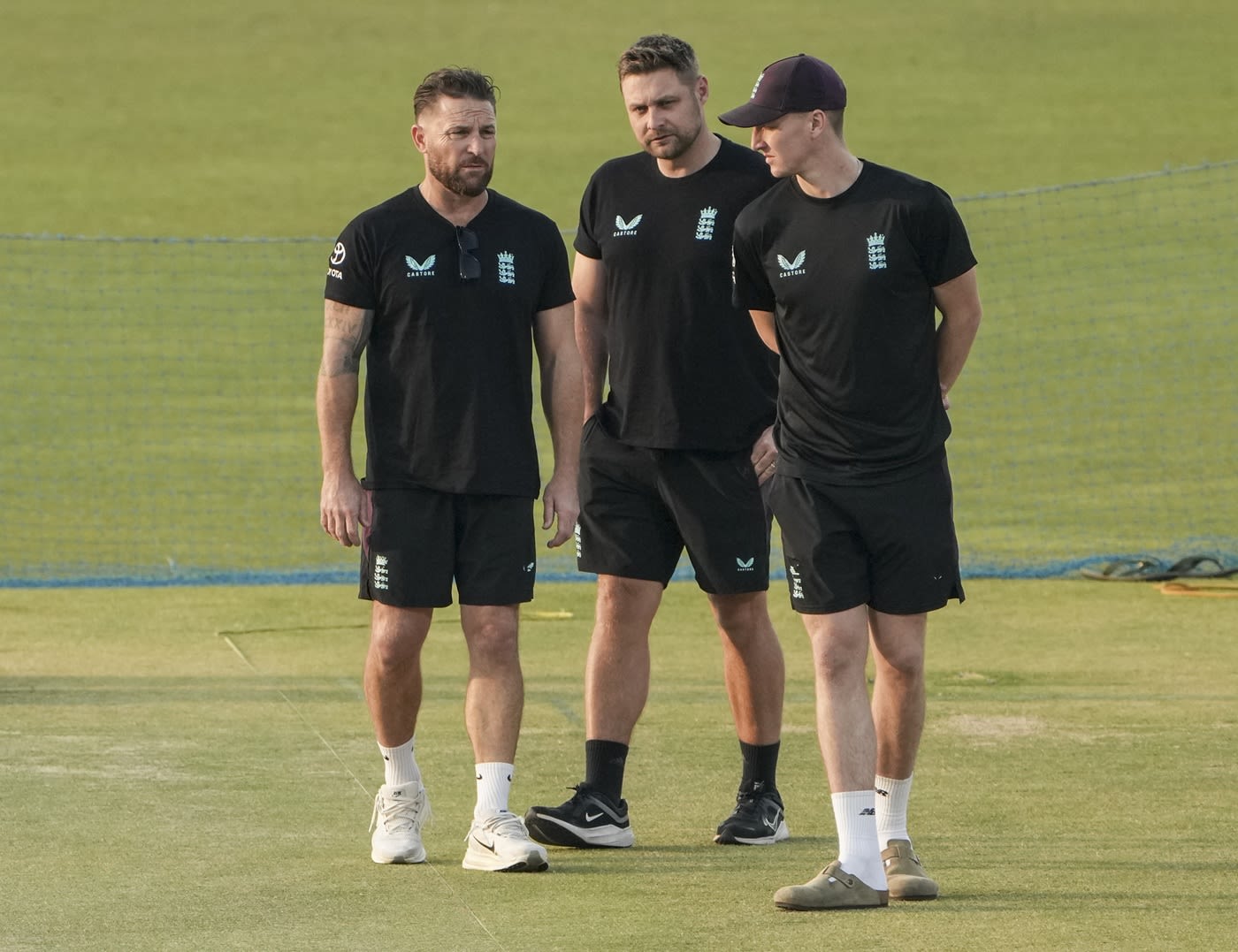 England head coach Brendon McCullum, selector Luke Wright and captain Harry Brook look at the Eden Gardens pitch