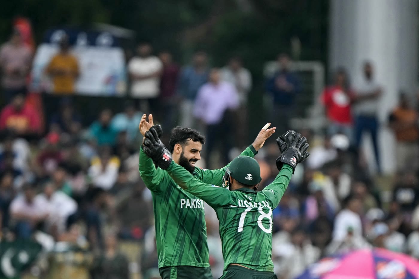Shadab Khan celebrates with Usman Khan