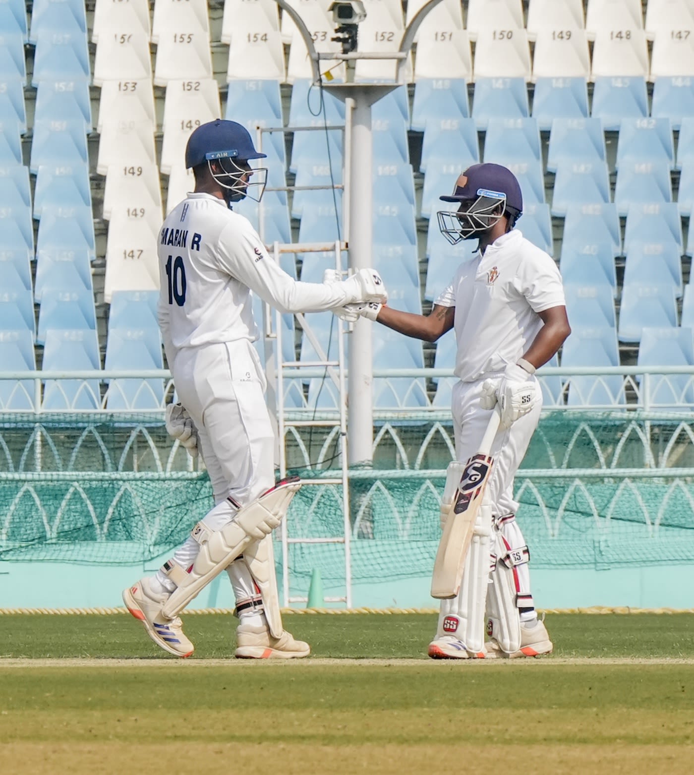 R Smaran congratulates Kruthik Krishna after the latter got to his half-century