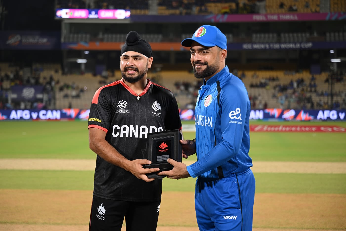 Dilpreet Bajwa and Rashid Khan before the toss