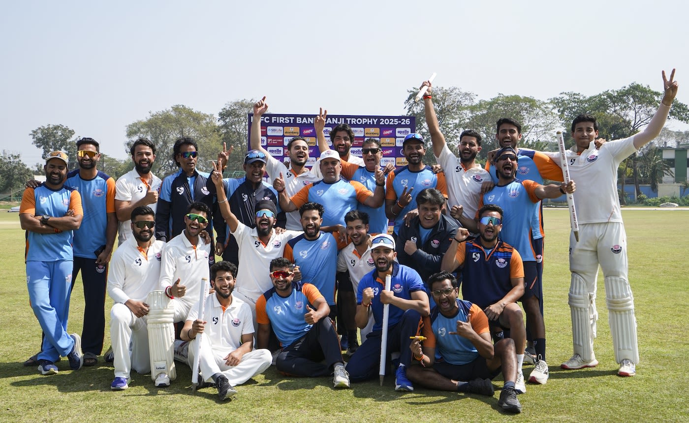 Jammu & Kashmir's players celebrate their semi-final win with coach Ajay Sharma