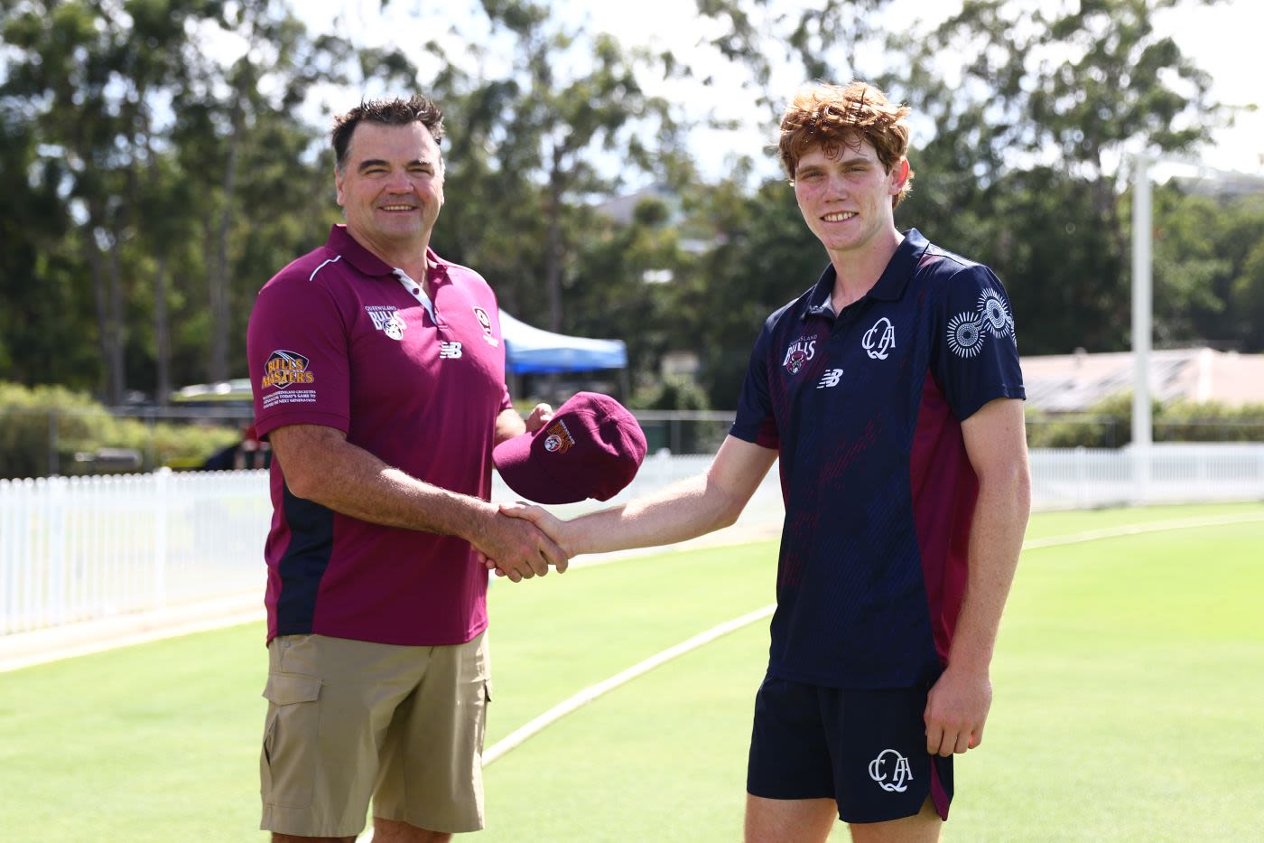 Joe Dawes presents Callum Vidler with his maiden Queensland cap