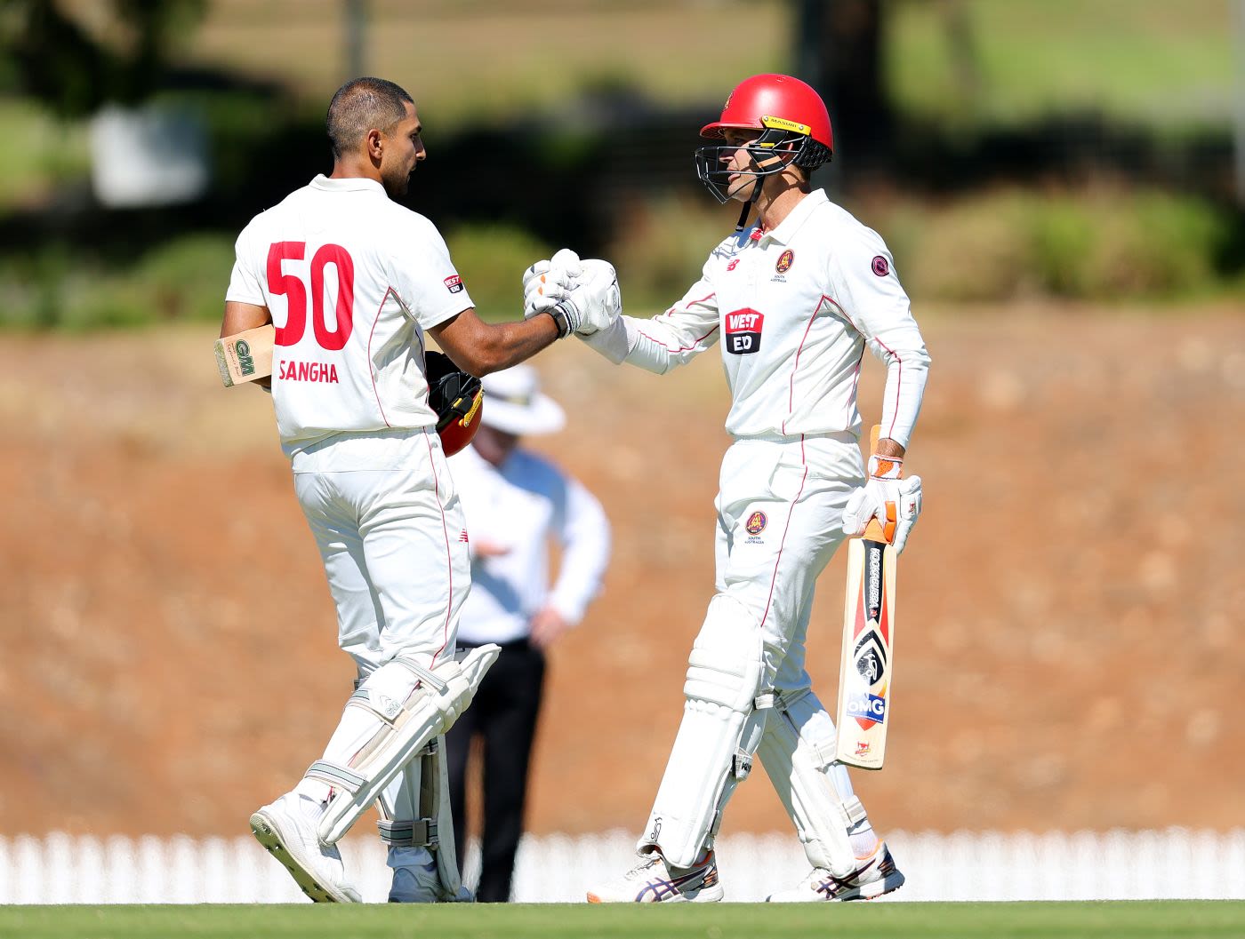 Jason Sangha celebrates his century with Alex Carey
