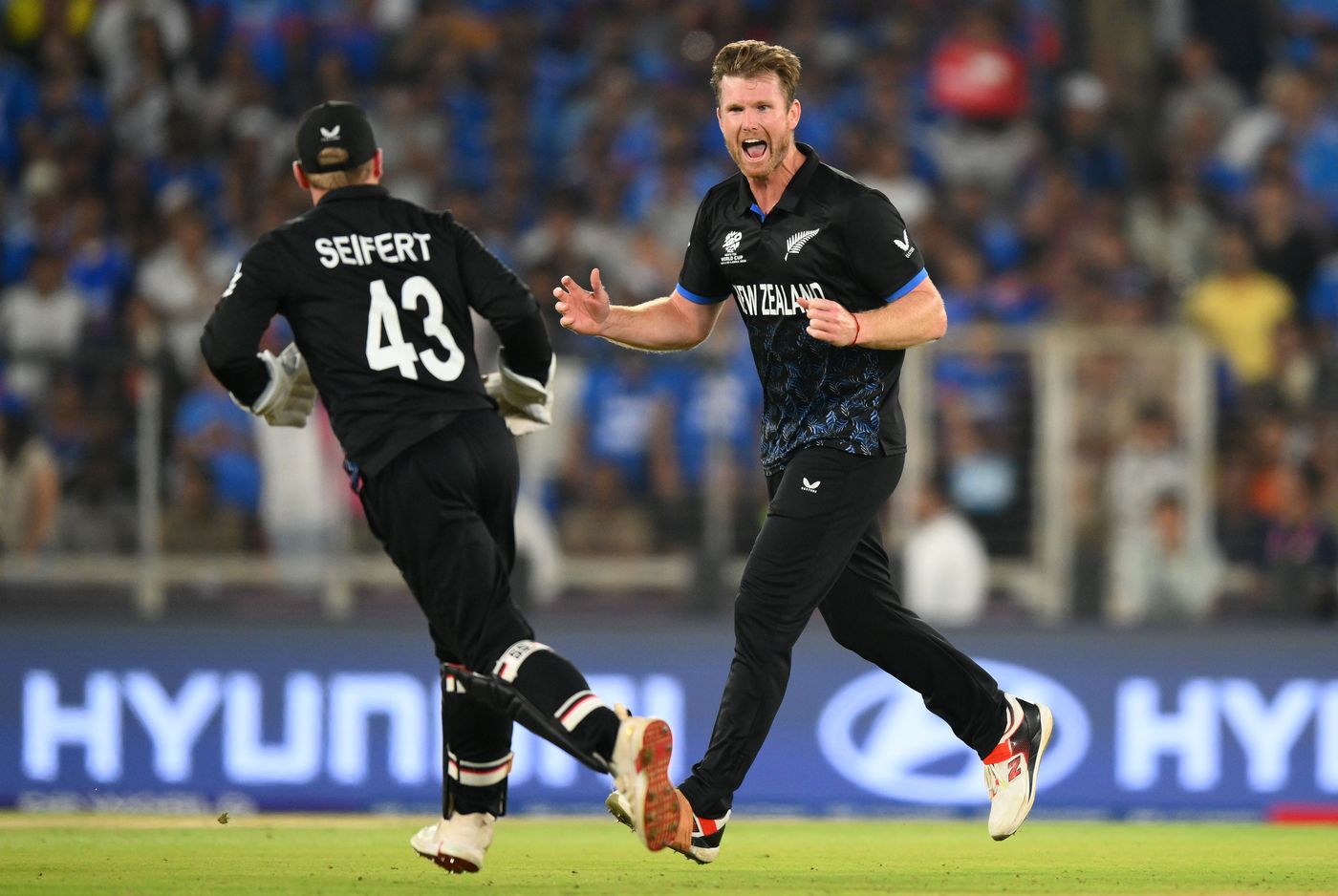James Neesham celebrates a wicket