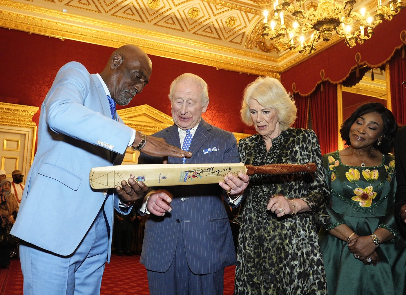 Viv Richards gifts a cricket bat to King Charles III and Queen Camilla during the annual Commonwealth Day Reception