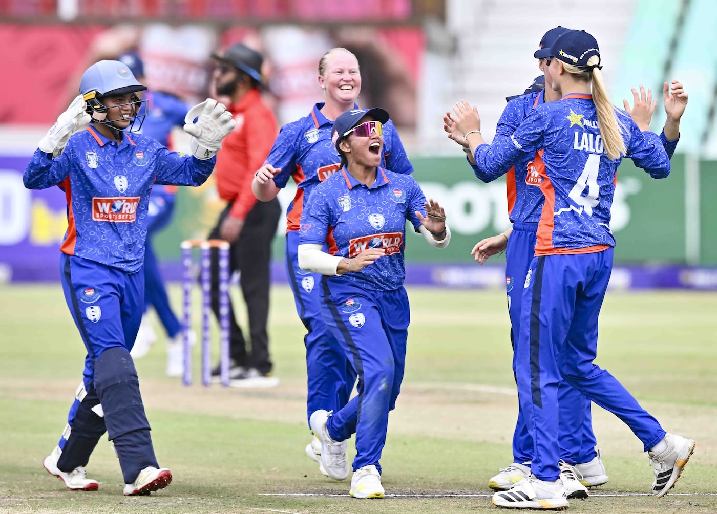 Delmi Tucker (centre, background) took three wickets in the final