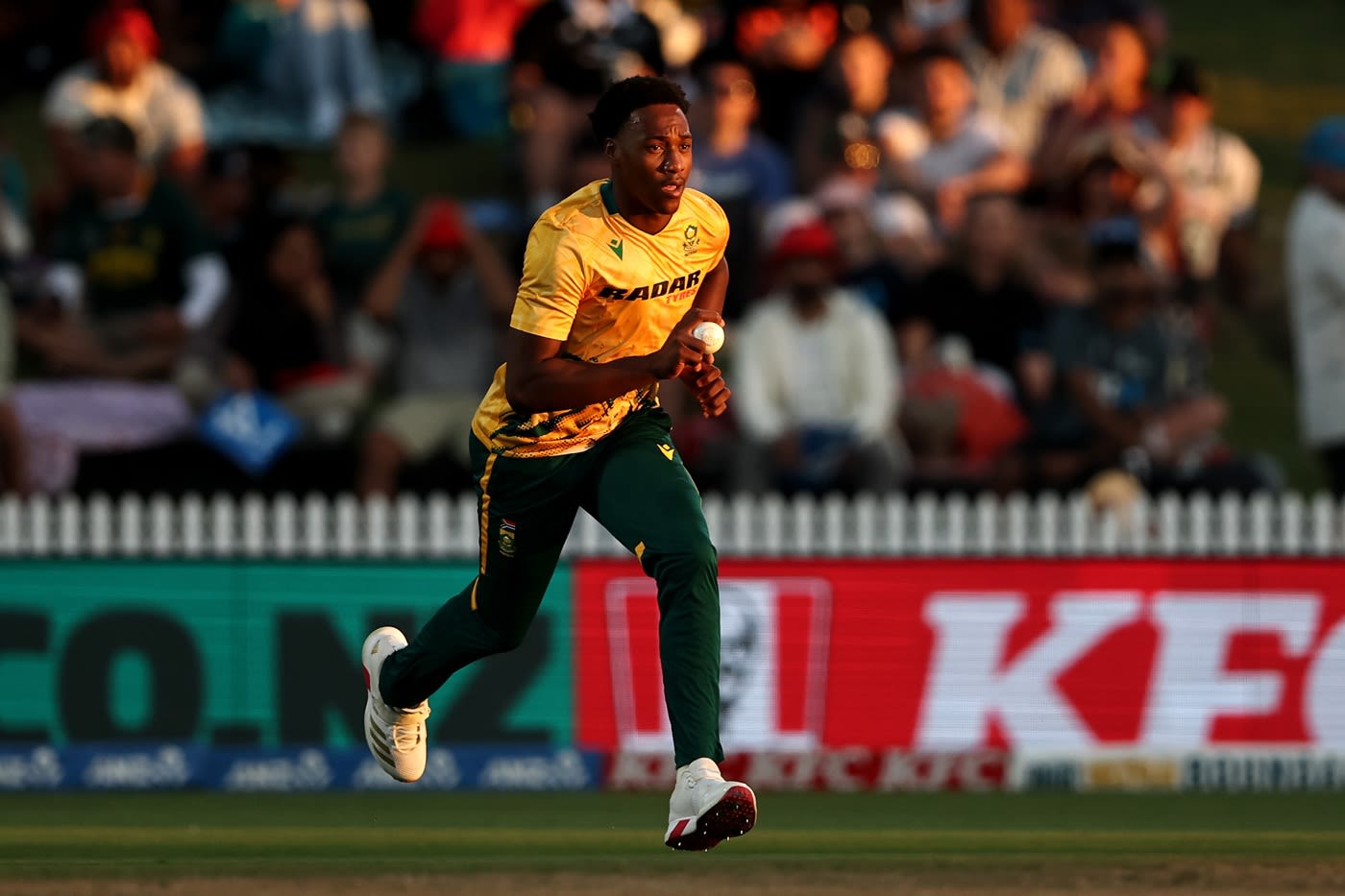 Nqobani Mokoena runs in to bowl