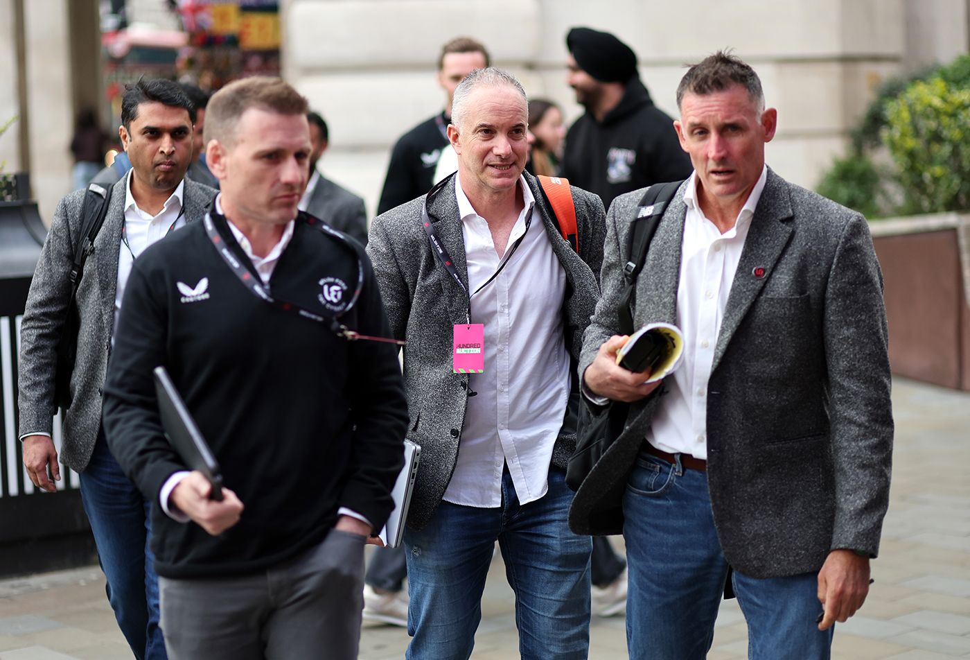 Welsh Fire's Michael Klinger (centre) and Mike Hussey (right) arrive at the Hundred auction