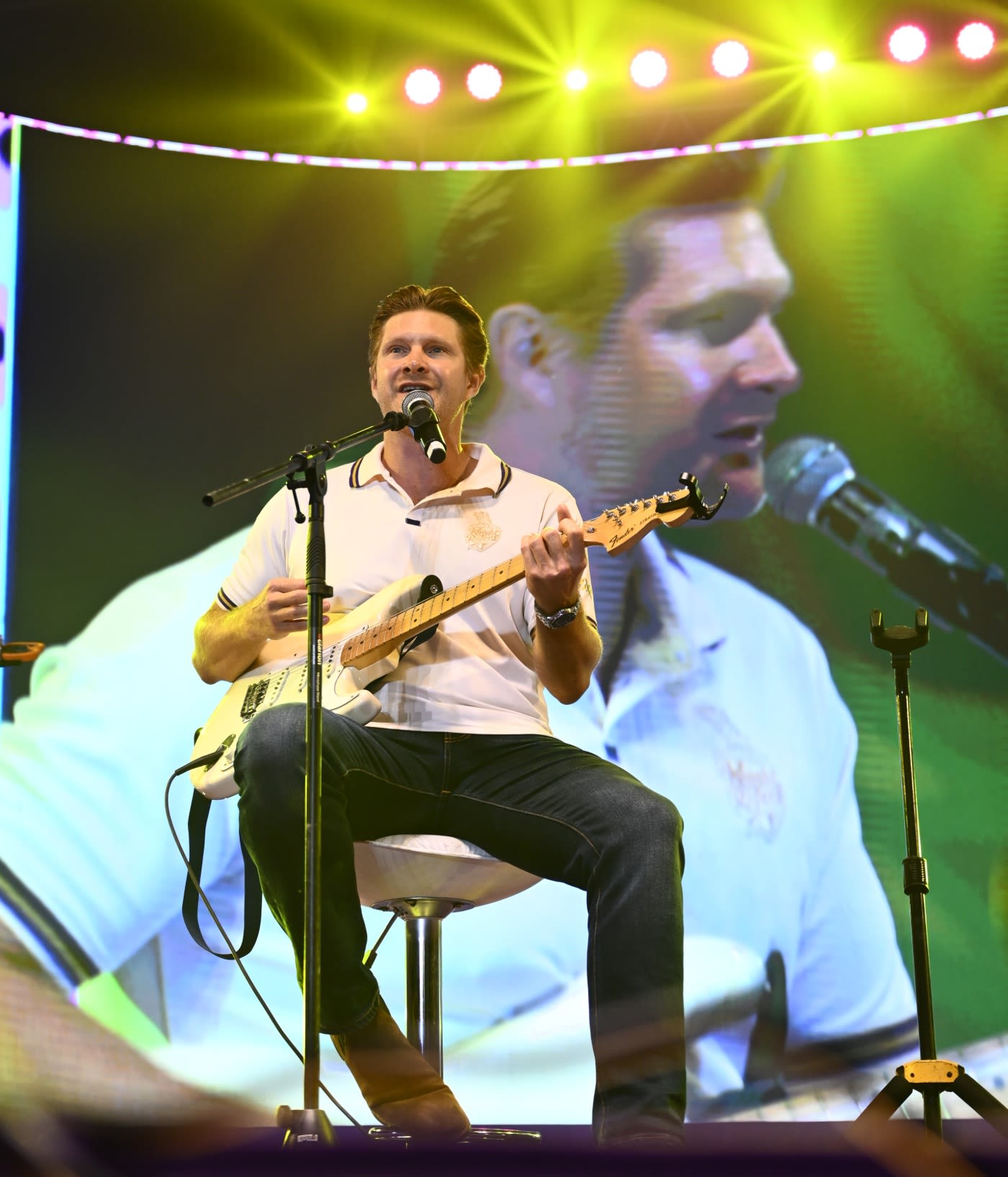 Shane Watson plays the guitar