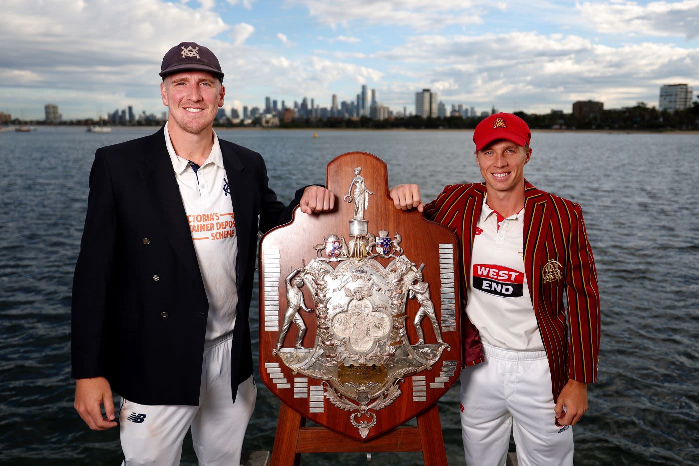 Victoria captain Will Sutherland and South Australia captain Nathan McSweeney pose with the Sheffield Shield in Melbourne ahead of the final