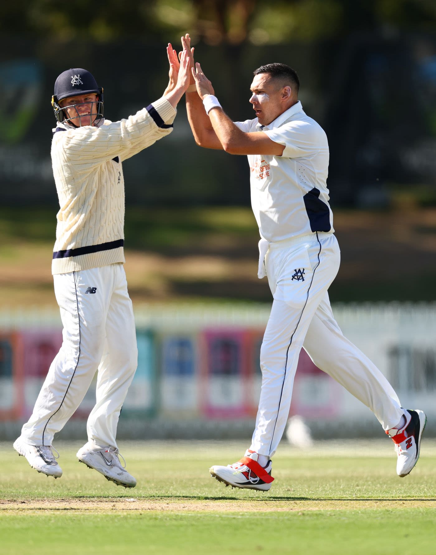 Scott Boland celebrates a wicket with Ollie Peake