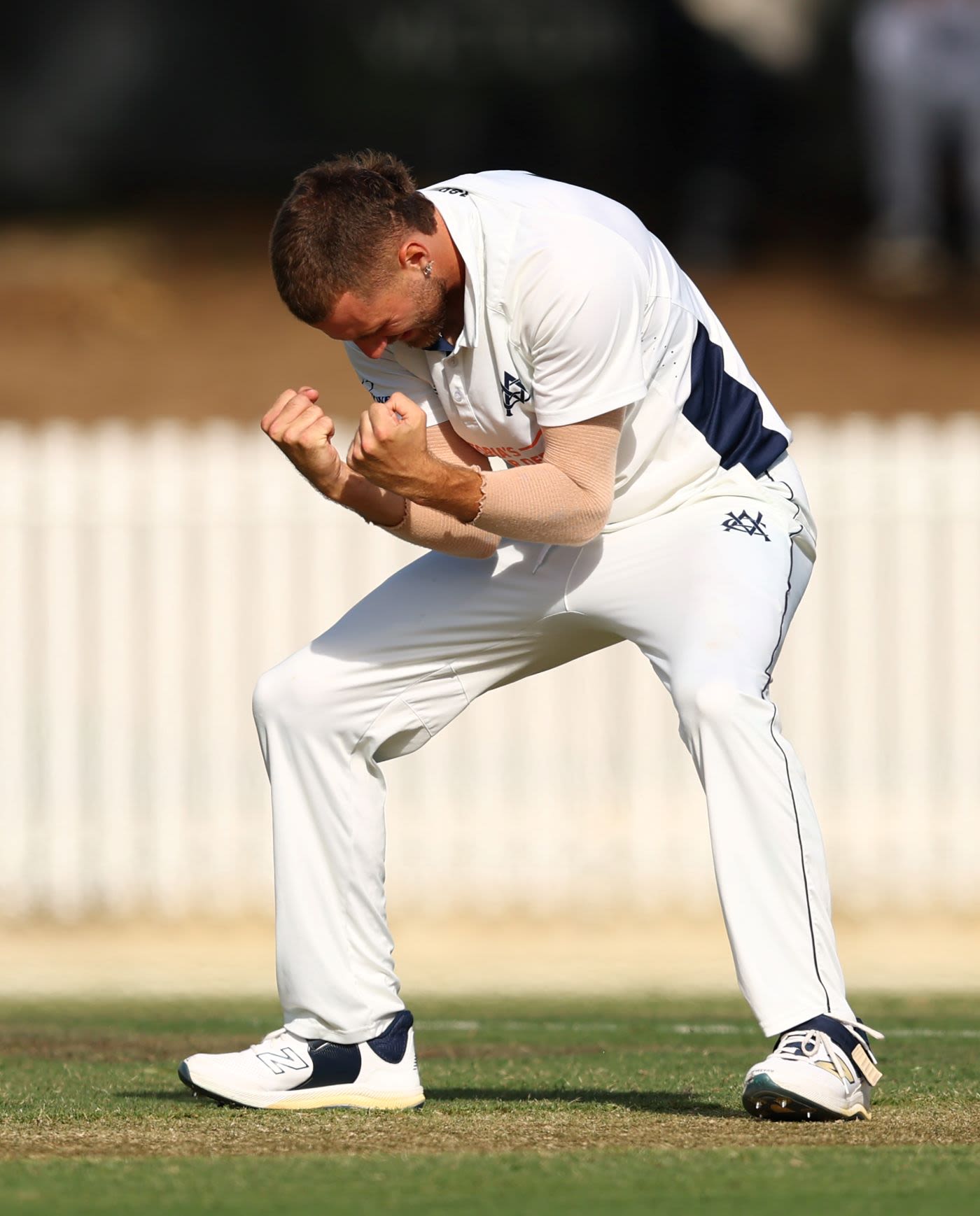Fergus O'Neill celebrates a wicket