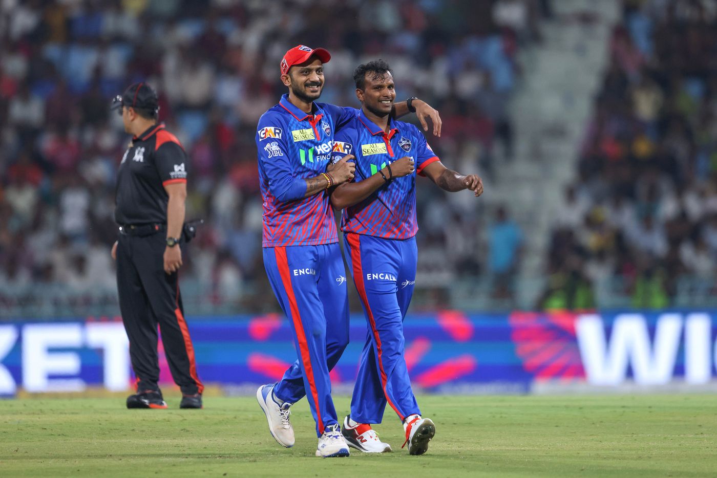 T Natarajan and Axar Patel celebrate a wicket