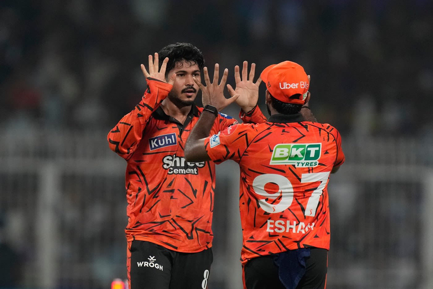 Eshan Malinga and Shivang Kumar celebrate after running out Angkrish Raghuvanshi