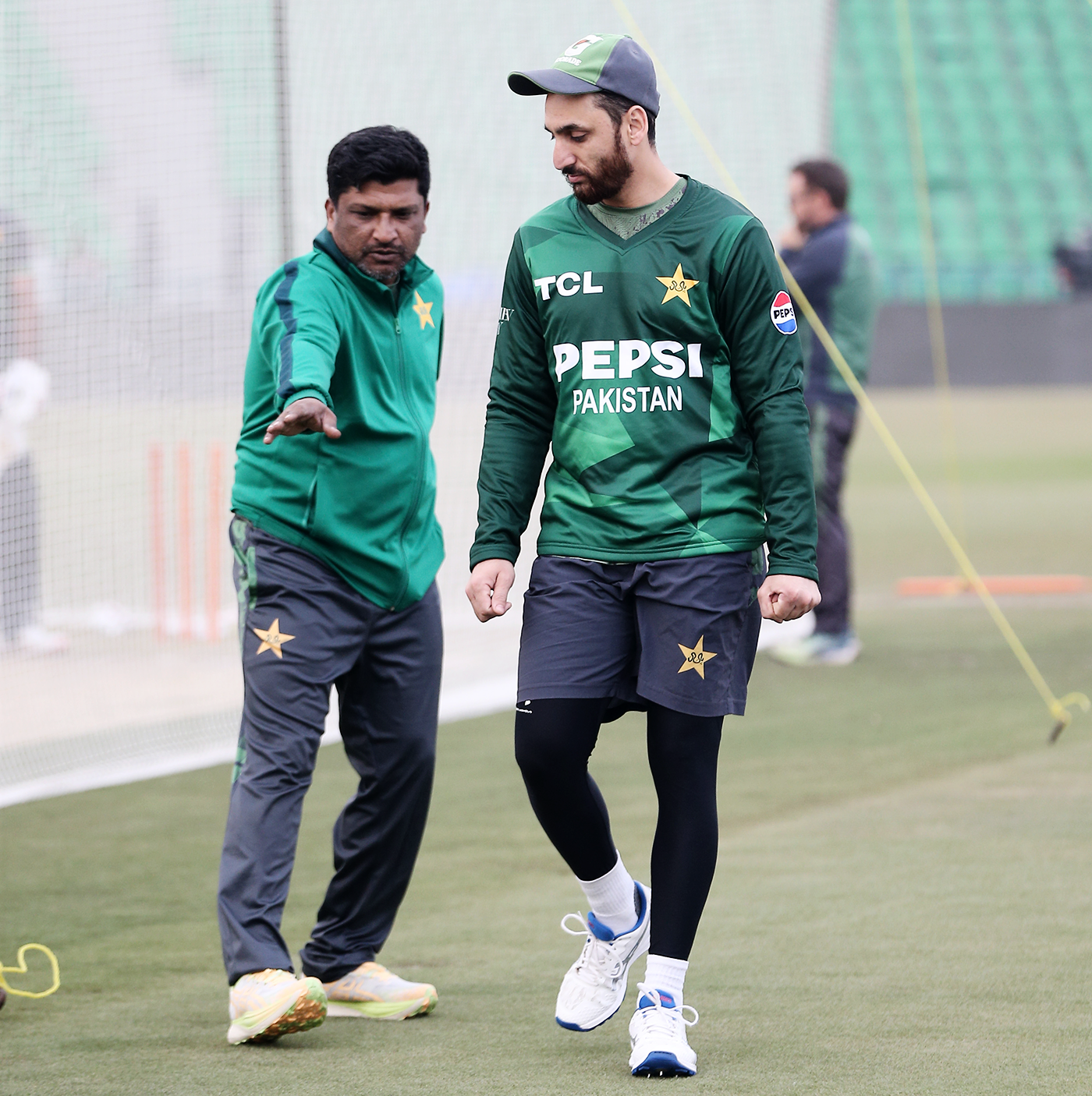 Pakistan batting coach Hanif Malik talks to captain Salman Agha