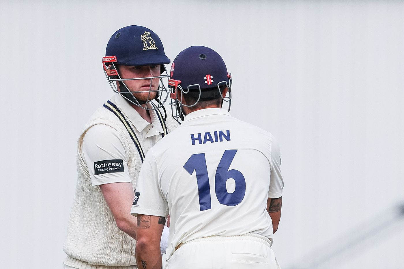 Dan Mousley is congratulated on reaching fifty by Sam Hain
