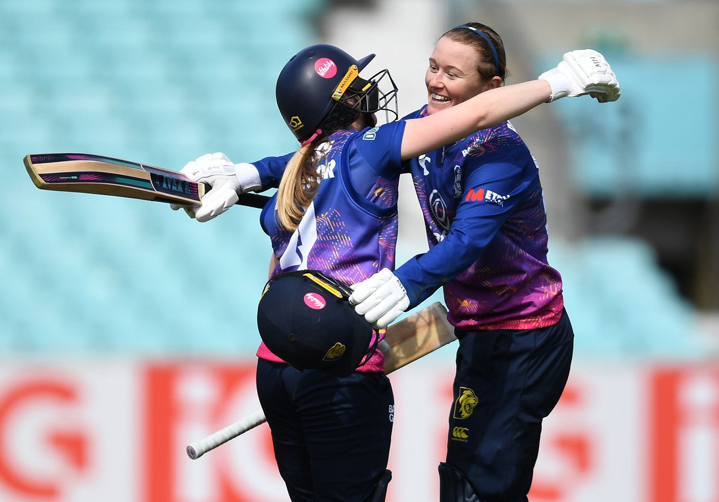 Hollie Armitage celebrates reaching her hundred