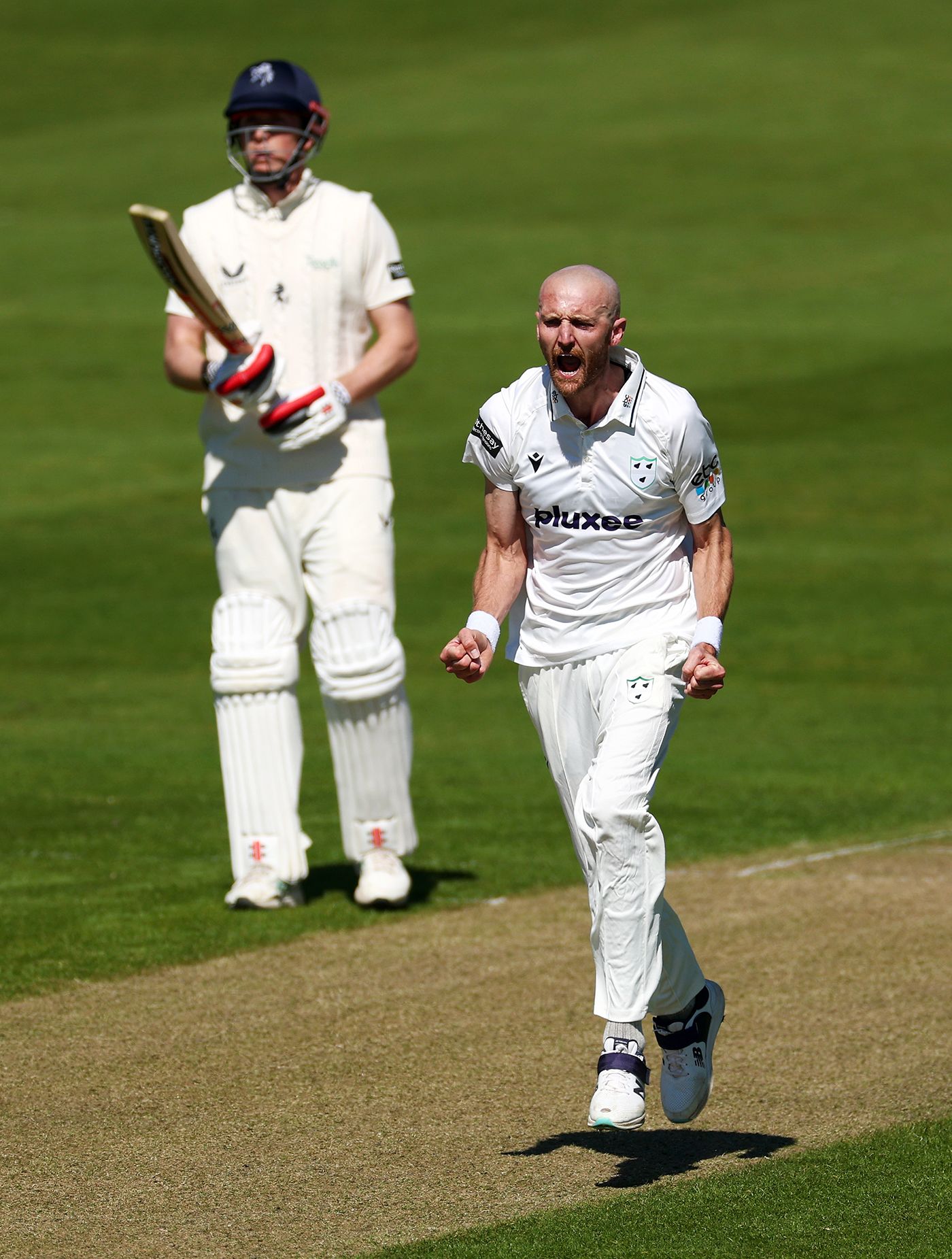 Oliver Hannon-Dalby celebrates the dismissal of Ben Compton