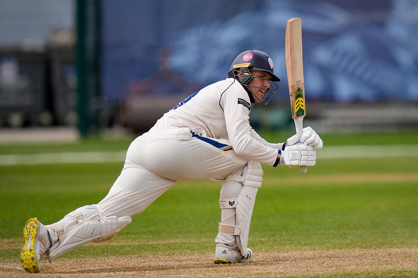 Luis Reece sweeps during his half-century