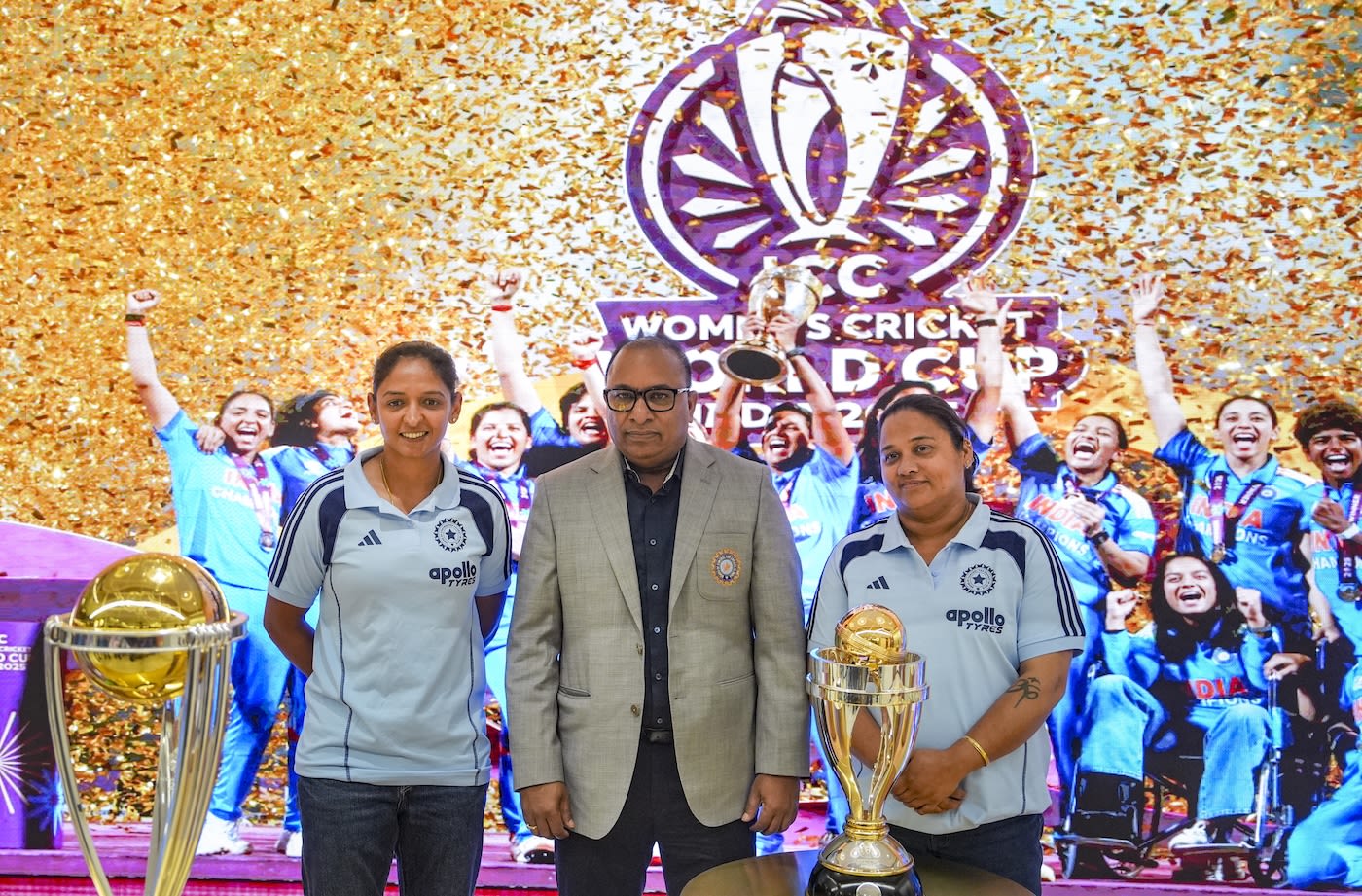 Harmanpreet Kaur, Devajit Saikia and Amita Sharma pose with the ODI World Cup trophy