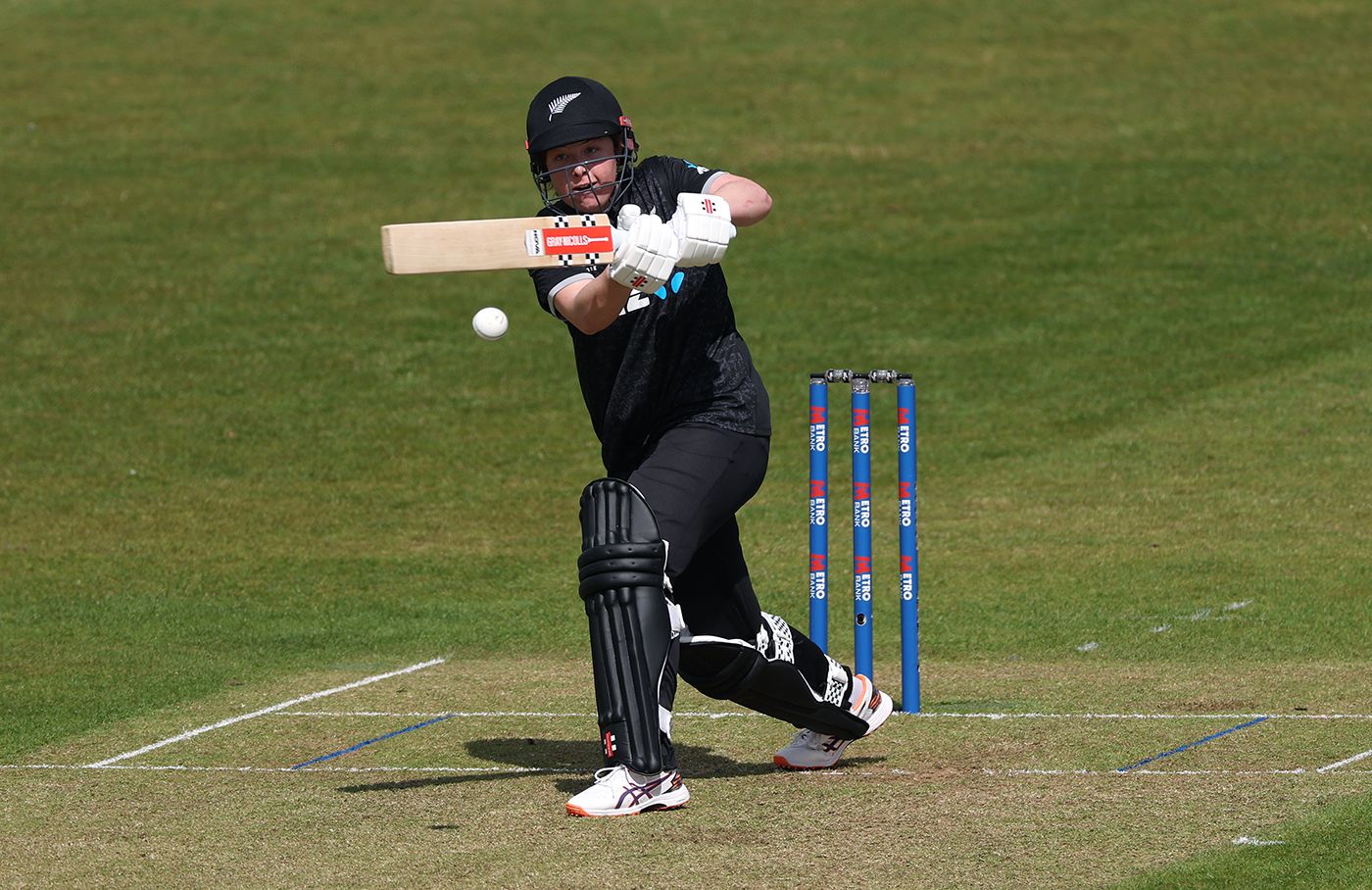 Georgia Plimmer punches into the on side