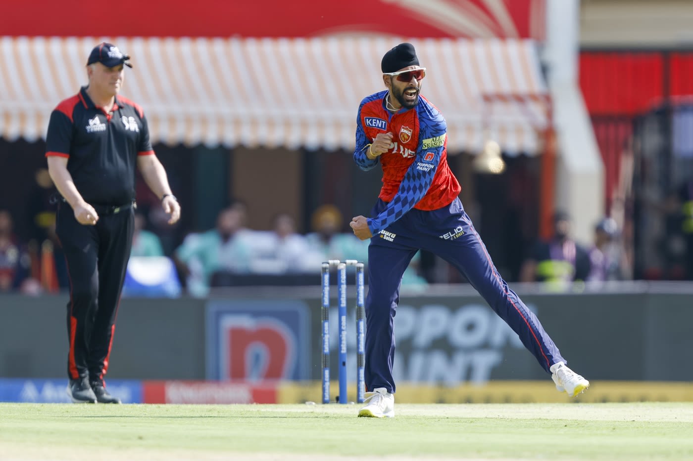 Harpreet Brar is pumped after striking in his first over