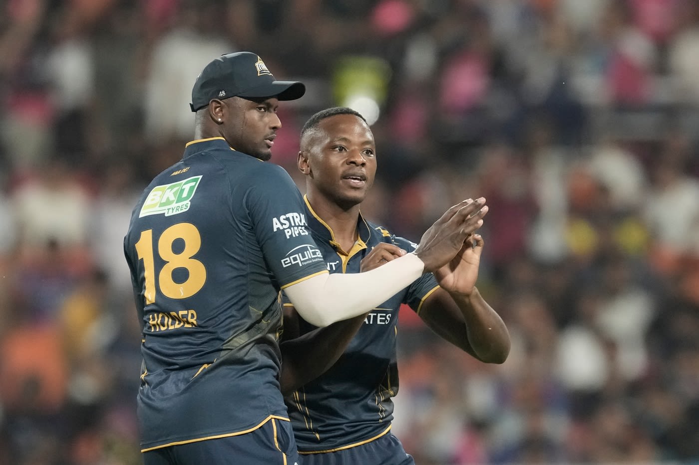 Kagiso Rabada celebrates with Jason Holder