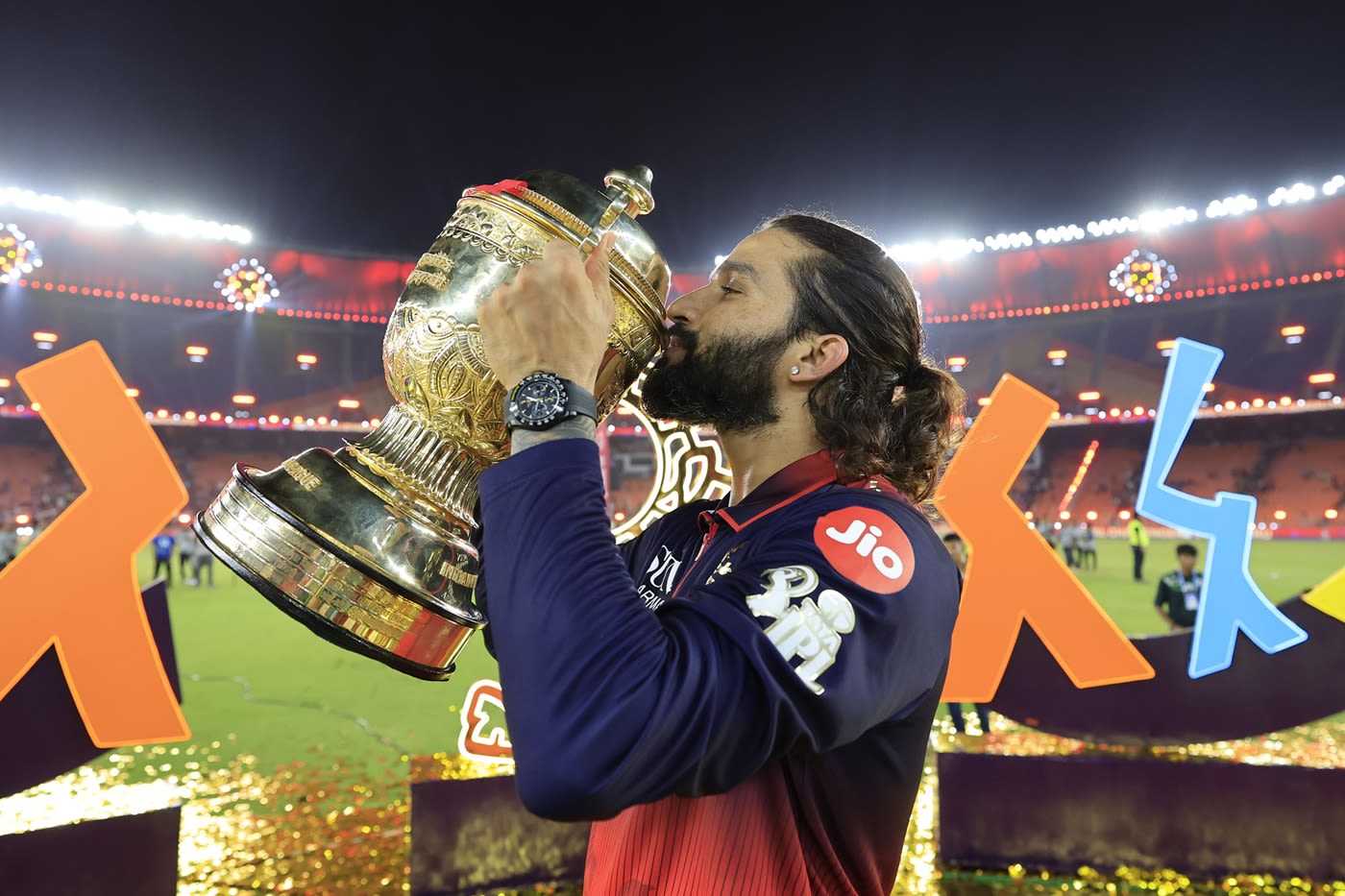 Rajat Patidar gives the IPL trophy a kiss