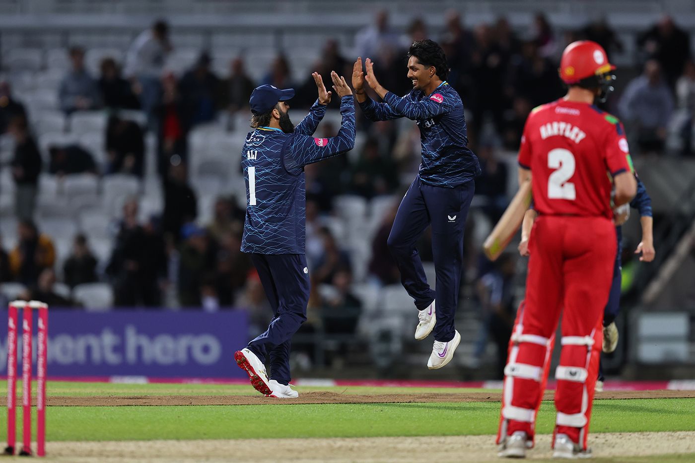 Jafer Chohan celebrates with Moeen Ali