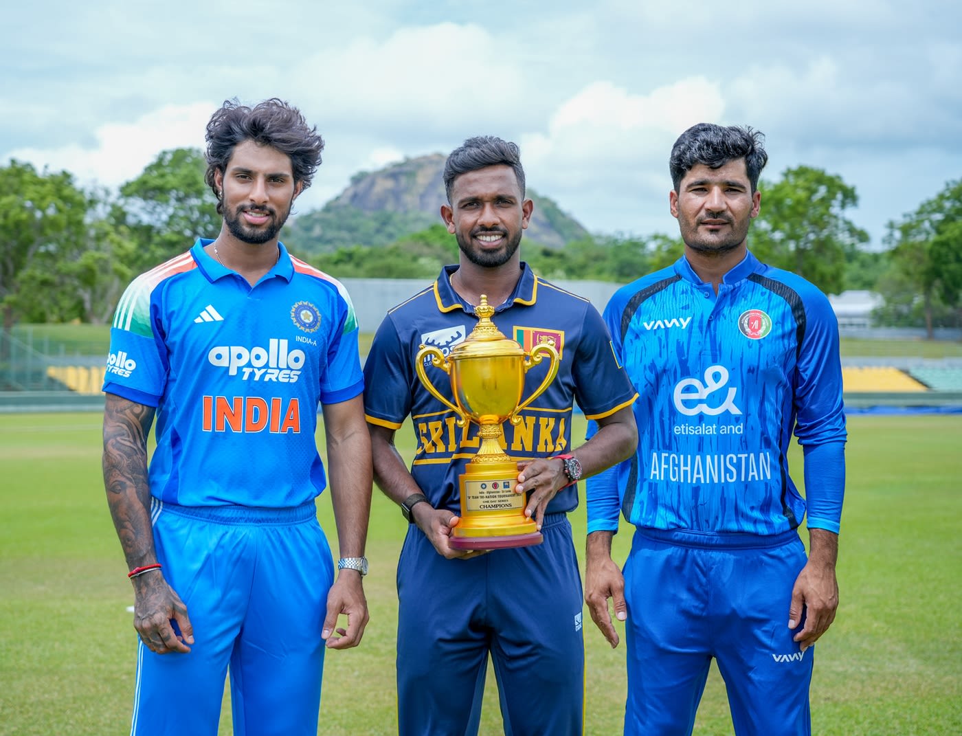 Tilak Varma, Sahan Arachchige and Imran Mir pose with the trophy
