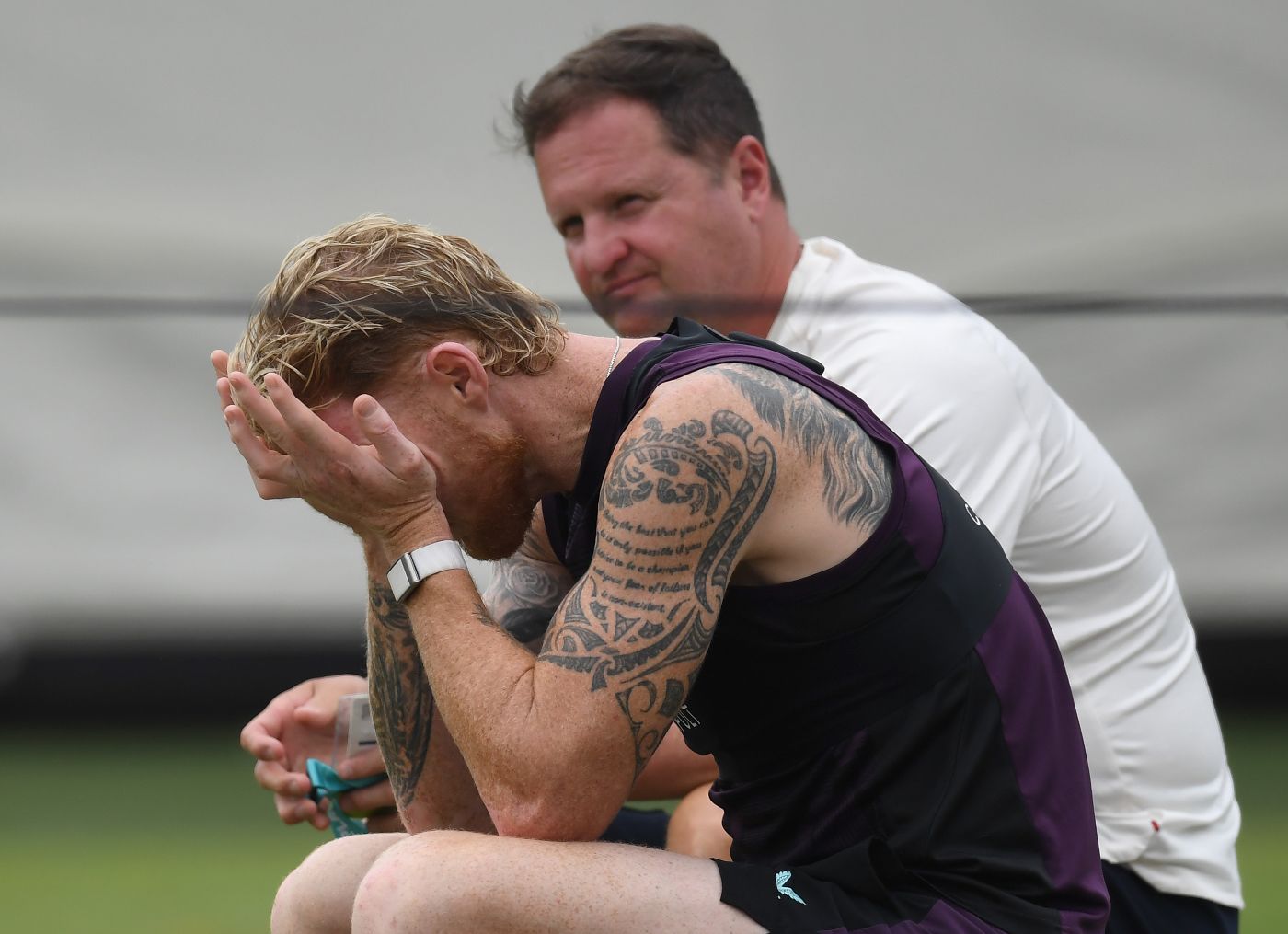 Rob Key looks on as Ben Stokes holds his head during training ahead of the final Ashes Test