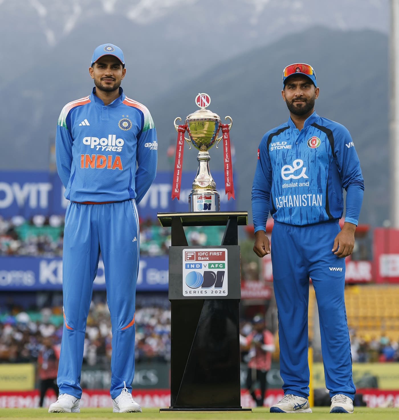 Shubman Gill and Hashmatullah Shahidi pose with the series trophy in Dharamsala