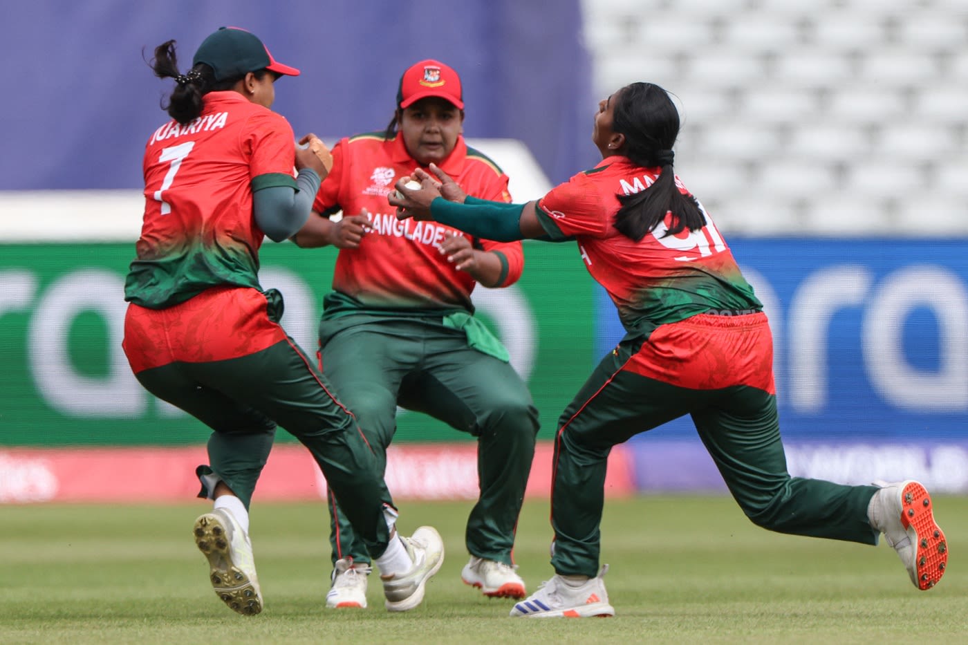 Marufa Akter completes a return catch as Juairiya Ferdous and Sanjida Akter Meghla try to avoid a collision