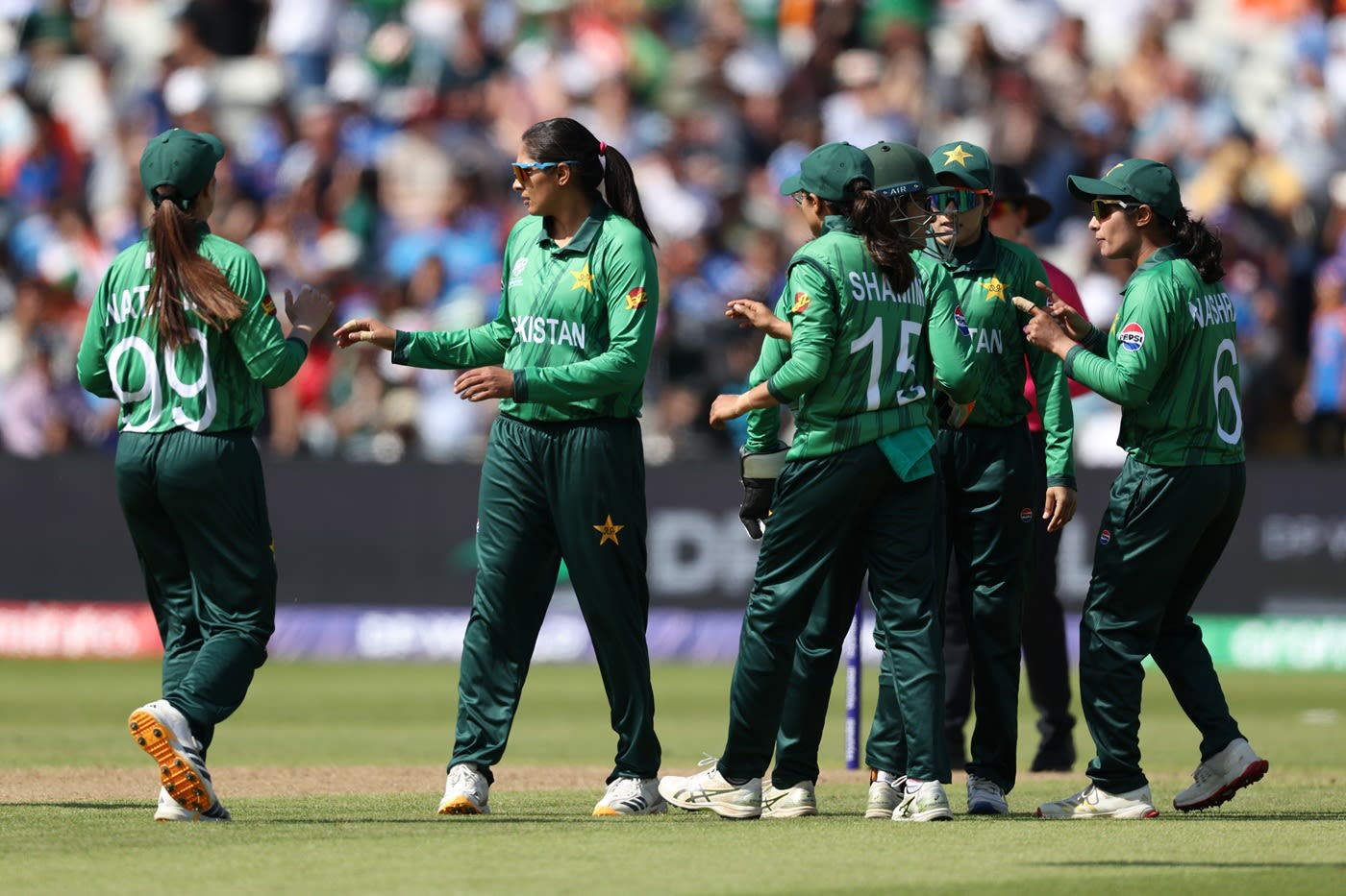 Sadiq Iqbal celebrates a wicket with her team-mates