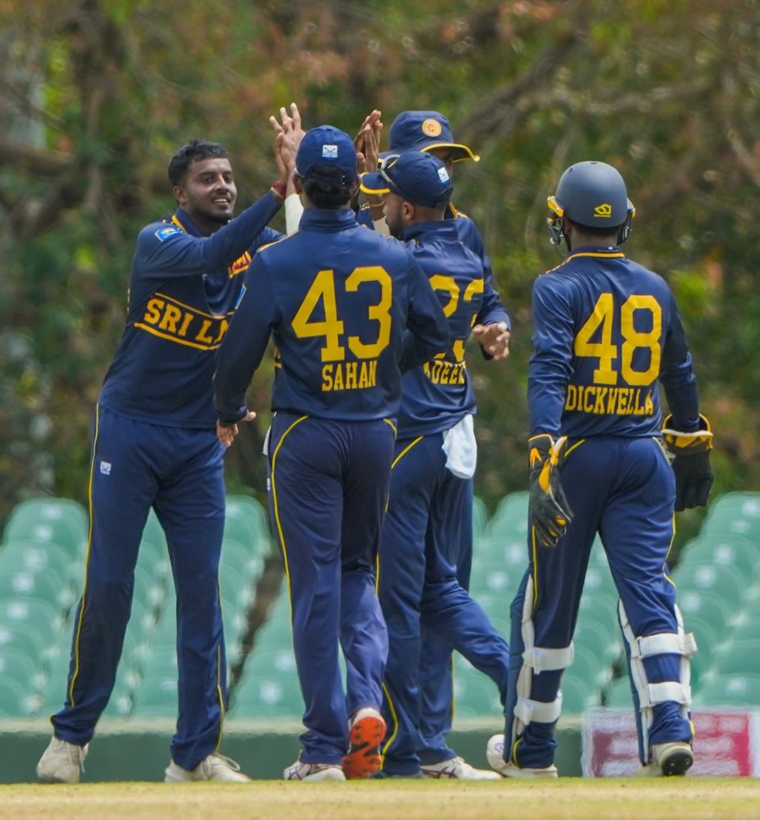 Vijayakanth Viyaskanth celebrates a wicket with his team-mates